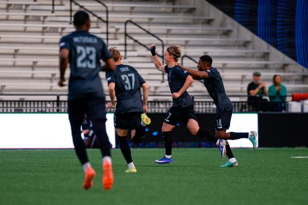 Colorado Springs Switchbacks FC congratulate Jonas Fjeldberg on his goal