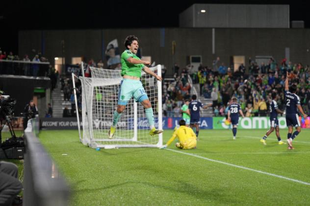 Seattle Sounders FC midfielder Paul Rothrock reacts after his goal against Vancouver Whitecaps FC