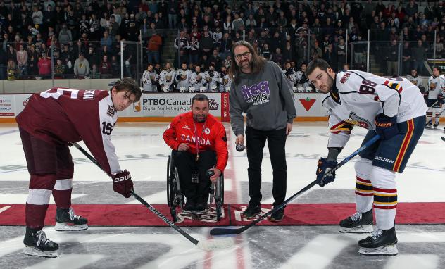 Puck drop between the Peterborough Petes and Barrie Colts with Paralympian Jon Thurston