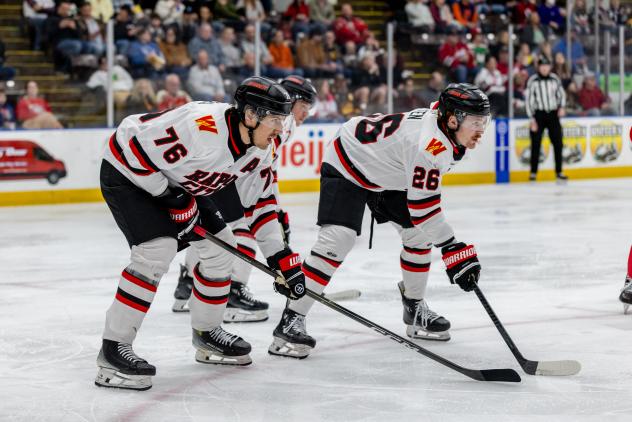 Rapid City Rush defenseman Xavier Bernard (left) and forward Seth Fyten