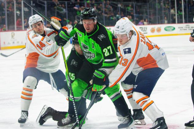 Greenville Swamp Rabbits' Caiden Gault and Josh Zary battle Savannah Ghost Pirates' Liam Walsh and Nick Granowicz