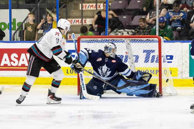 Kelowna Rockets' Ty Halaburda and Penticton Vees' AJ Reyelts in action