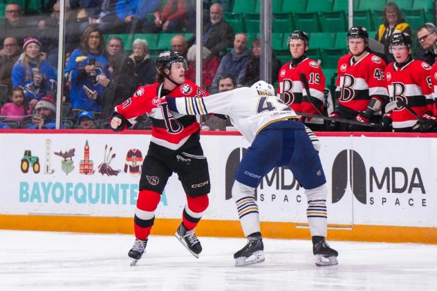 Belleville Senators centre Keean Washkurak (left) fights the Springfield Thunderbirds