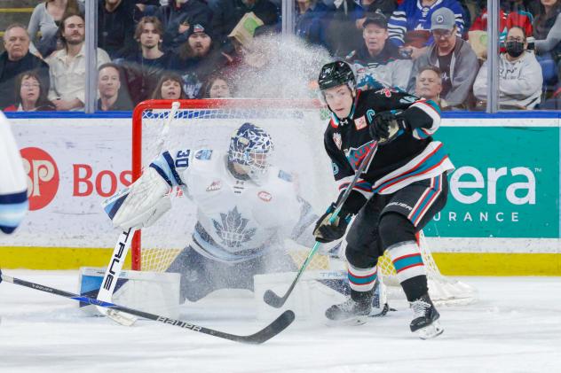 Penticton Vees' Ethan McCallum and Kelowna Rockets' Carson Wetsch in action
