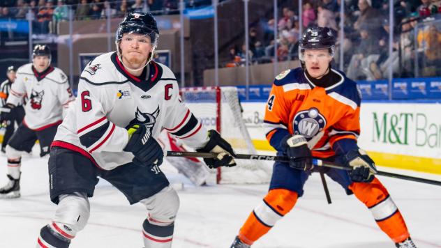 Adirondack Thunder defenseman Ryan Wheeler (left) vs. the Worcester Railers