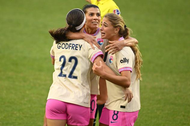 Lia Godfrey, Kenza Dali and Kimmi Ascanio (l to r) of San Diego Wave FC celebrate following the winning goal
