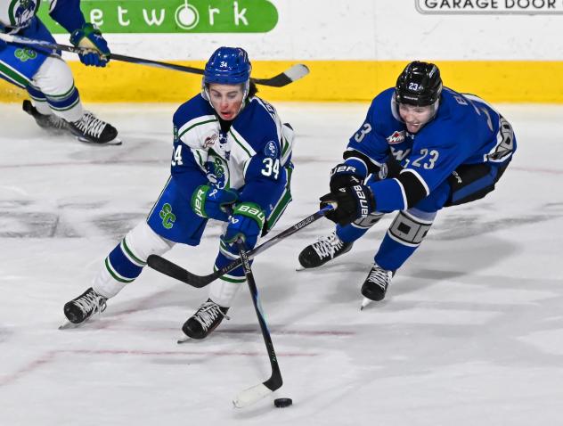 Wenatchee Wild forward Sam Elliott (right)