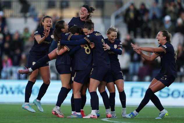 Seattle Reign FC celebrate a goal against the Kansas City Current