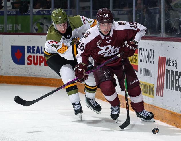 Peterborough Petes right wing Francis Parish (right) vs. the North Bay Battalion
