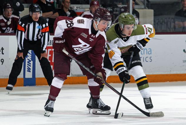 Peterborough Petes' Brennan Faulkner and North Bay Battalion's Ryder Carey on game night