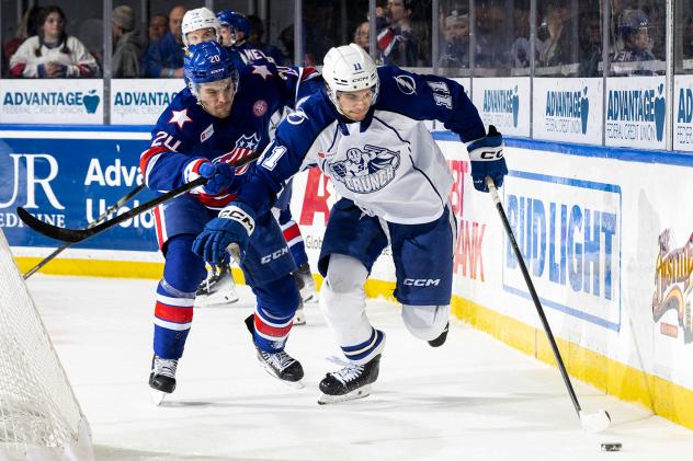 Syracuse Crunch center Lucas Mercuri with the puck vs. the Rochester Americans
