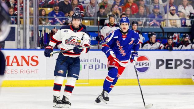 Saginaw Spirit center Carson Harmer (left) vs. the Kitchener Rangers