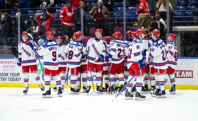Kitchener Rangers exchange congratulations after a big win