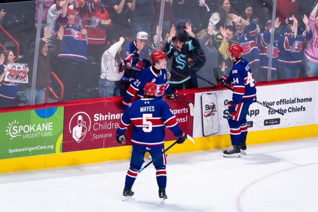 Spokane Chiefs gather after a big goal against the Prince George Cougars