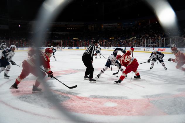 A Rapid City Rush faceoff from behind the glass