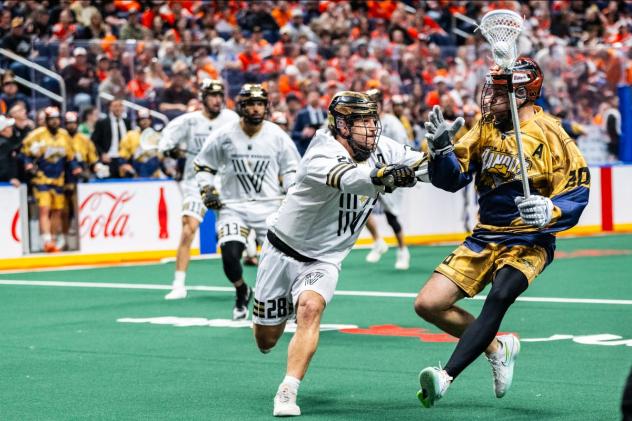 Vancouver Warriors defender Reid Bowering (left) vs. the Buffalo Bandits