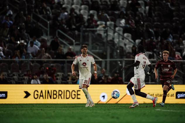 Phoenix Rising's Luke Biasi and Jean-Eric Moursou and Sacramento Republic FC's Blake Willey in action
