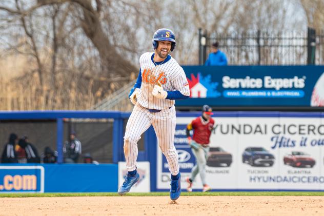 Jackson Cluff of the Syracuse Mets rounds the bases on his walk-off home run