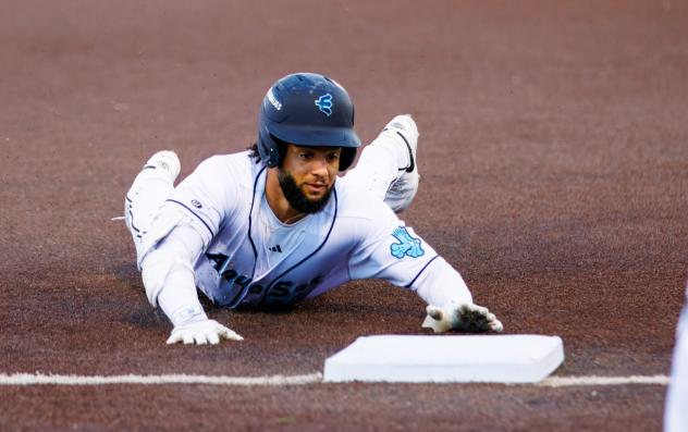 Carlos Jimenez of the Everett AquaSox slides into third