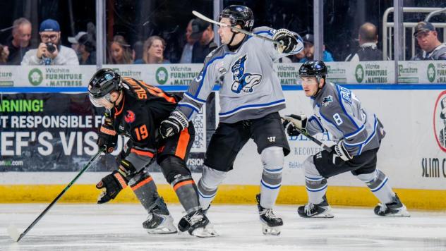 Kansas City's Nolan Sullivan and Wichita Thunder's T.J. Lloyd and Spencer Blackwell in action