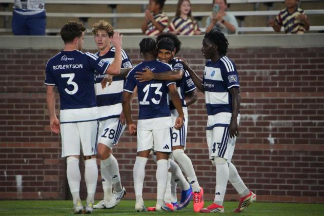 Chattanooga FC exchanges congratulations after a goal against Orlando City B