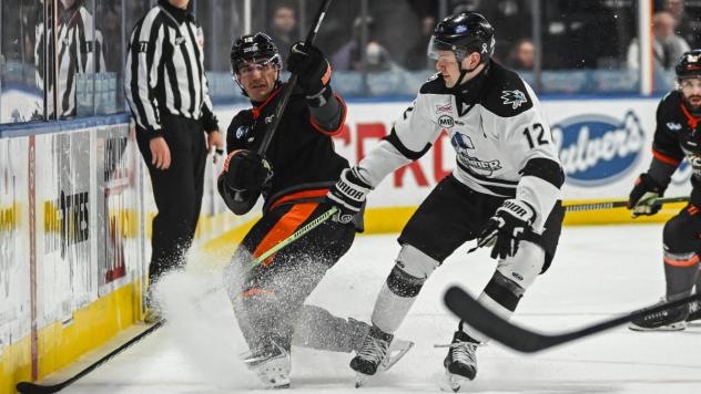 Wichita Thunder's Peter Bates battles the Kansas City Mavericks