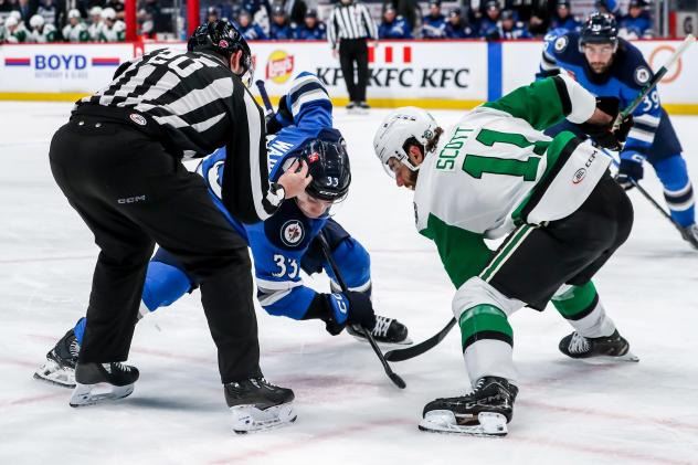 Texas Stars forward Harrison Scott faces off with the Manitoba Moose