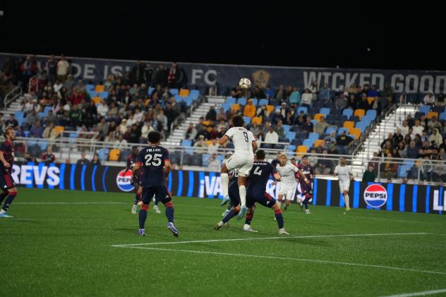 Rhode Island FC forward JJ Williams goes up for a header against the New England Revolution