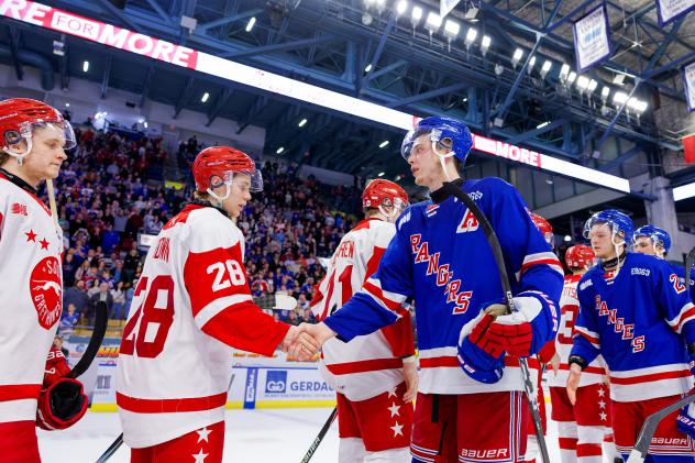 Kitchener Rangers shake hands with the Soo Greyhounds