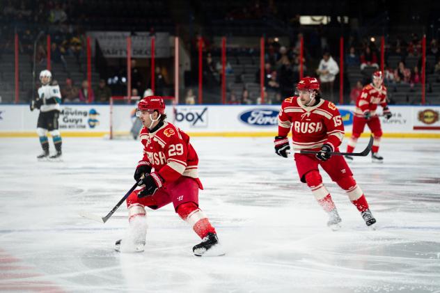 Rapid City Rush forward Ryan Chyzowski (left) and defenseman Bobby Russell