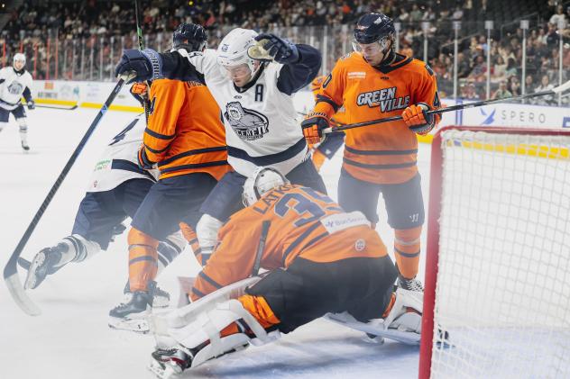 Greenville Swamp Rabbits goaltender Simon Latkoczy smothers a Jacksonville Icemen scoring attempt