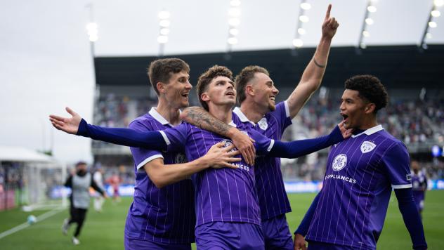 Louisville City FC congratulate Jansen Wilson after his goal