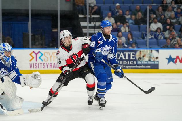 Syracuse Crunch defenseman Chris Harpur (right) vs. the Belleville Senators