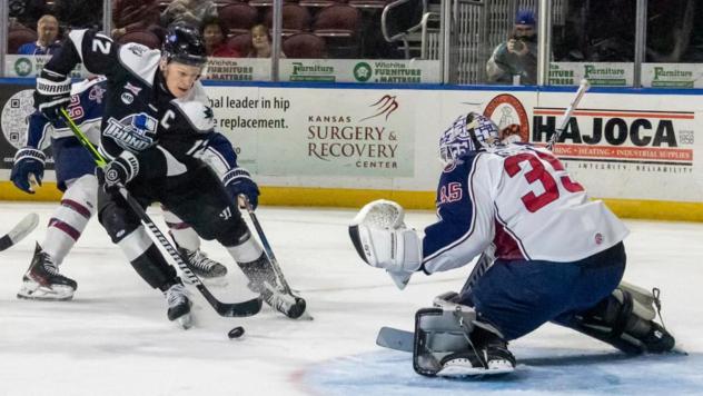 Wichita Thunder's Peter Bates battles Tulsa Oilers' Jake Sibell
