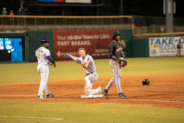 Mac Horvath of the Montgomery Biscuits safe at third