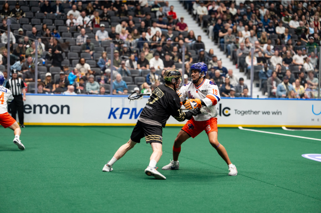 Vancouver Warriors' Curtis Dickson battles Halifax Thunderbirds' Nonkon Thompson