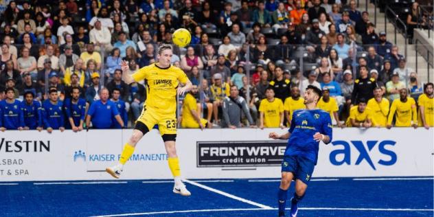 Milwaukee Wave's Max Ludwig and San Diego Sockers' Leo De Oliveira in action