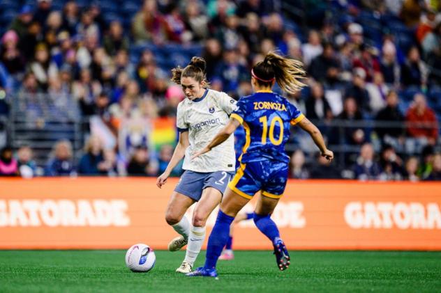 Reign FC forward Maddie Mercado with possession