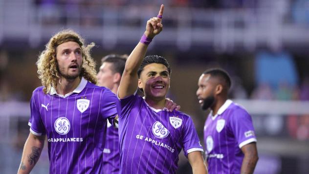Louisville City FC gather after Ray Serrano's goal