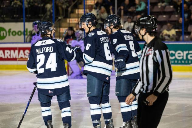 Penticton Vees discuss a score