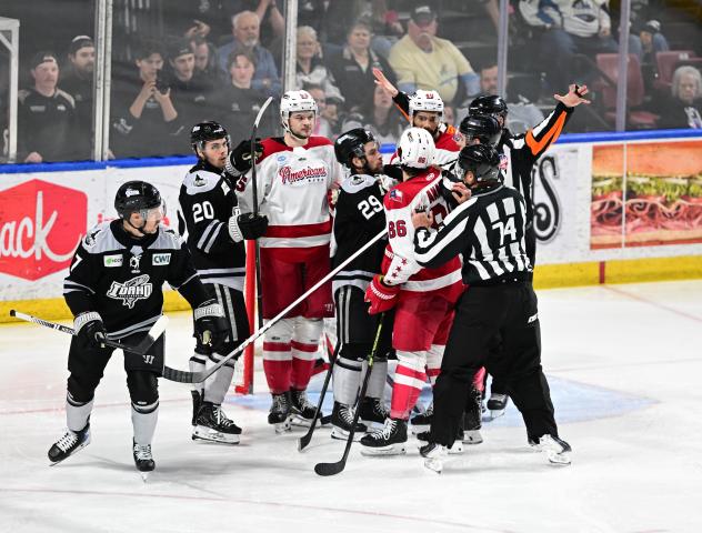 Allen Americans discuss the game with the Idaho Steelheads