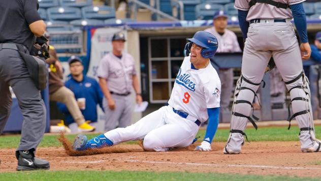 Chris Newell slides home for the Tulsa Drillers