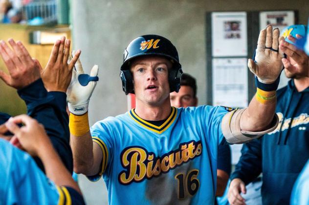 Montgomery Biscuits third baseman Mac Horvath gets high fives in the dugout