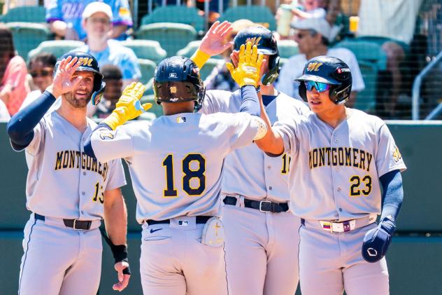 Montgomery Biscuits congratulate Jhon Diaz after his grand slam