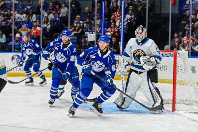 Syracuse Crunch centers Dylan Duke (left) and Matthew Peca vs. the Cleveland Monsters