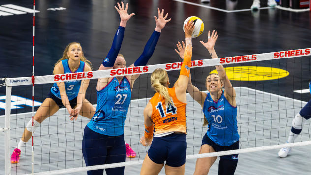 Omaha Supernovas opposite hitter Emily Londot (27) and middle blocker Kiara Reinhardt up front with outside hitter Brooke Nuneviller in back