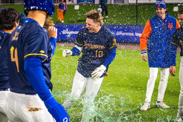 A.J. Ewing of the Syracuse Mets gets doused