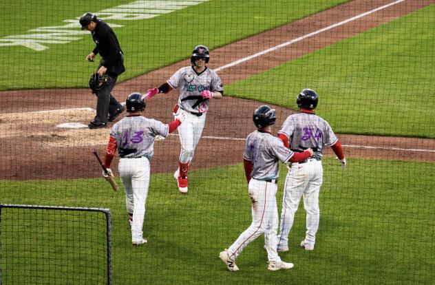 Worcester Red Sox shortstop Nick Sogard accepts congratulations after his three-run home run
