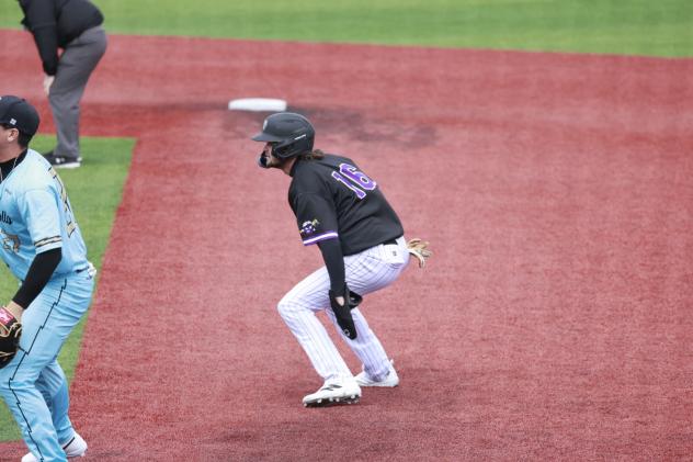 Lake Erie Crushers outfielder Joe Redfield leads off first