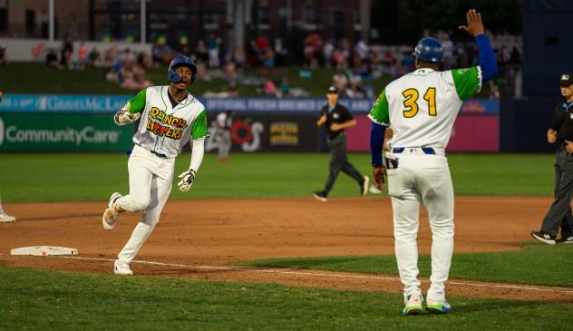 Tulsa Drillers' Josue De Paul gets a hero's welcome from Coach Johan Garcia